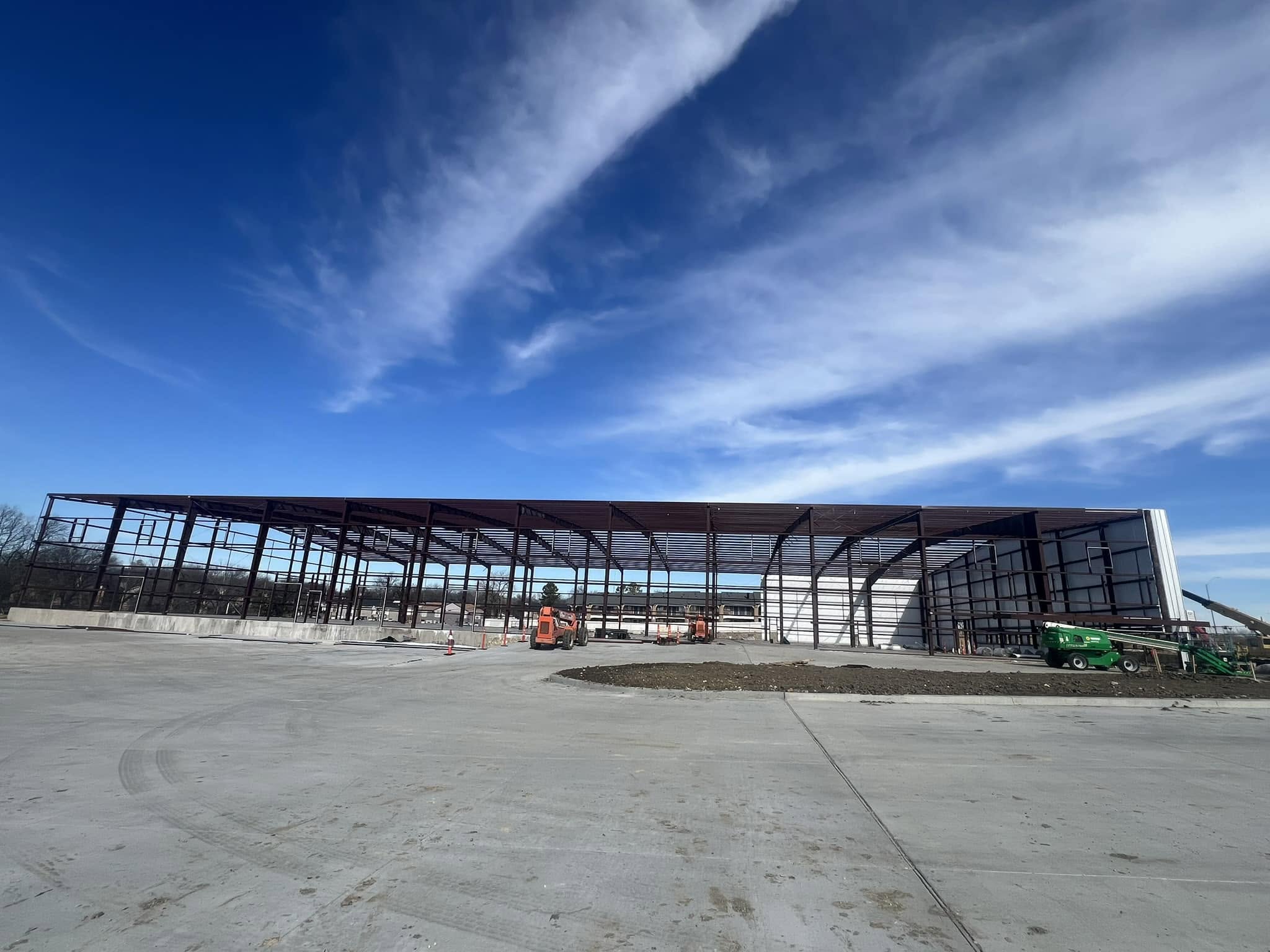 Triple W Metal Building Construction crew erecting a large commercial steel frame in North Texas